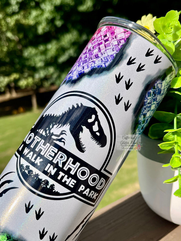 Motherhood is a Walk in the Park Dinosaur 20oz White Rainbow Skinny Tumbler