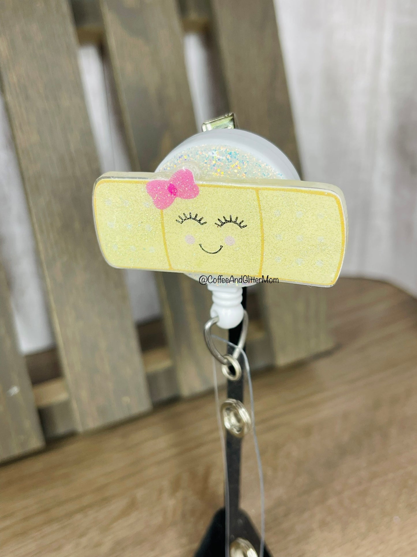 Glitter-back Happy Bandage Badge Reel