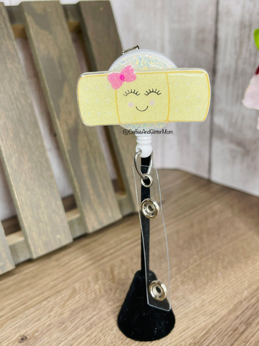 Glitter-back Happy Bandage Badge Reel