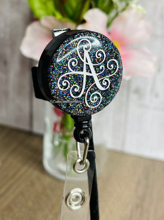 Holographic Black Swirly “A”  Badge Reel